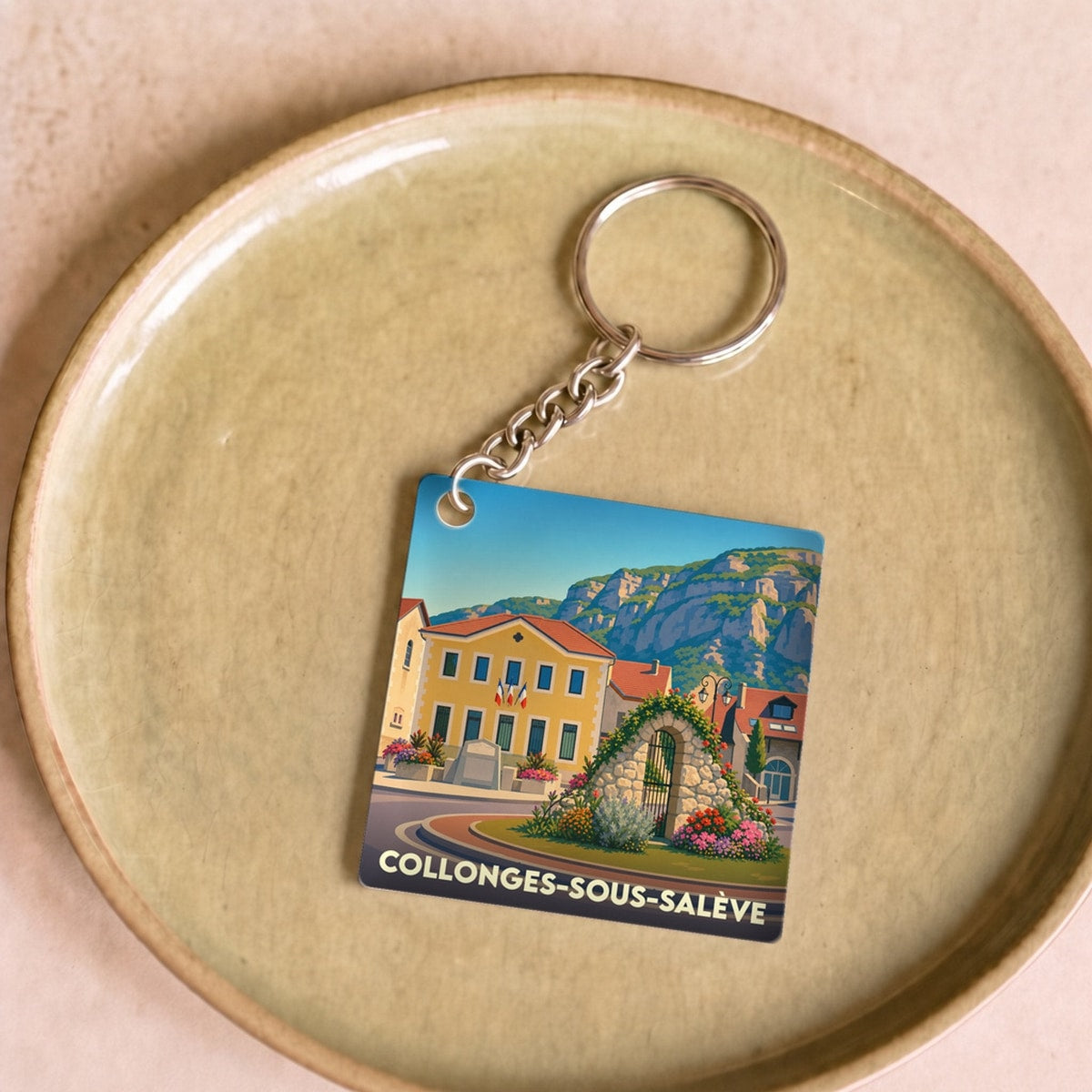 Porte-clés souvenir de la ville de Collonges-sous-Salève avec une illustration stylisée.