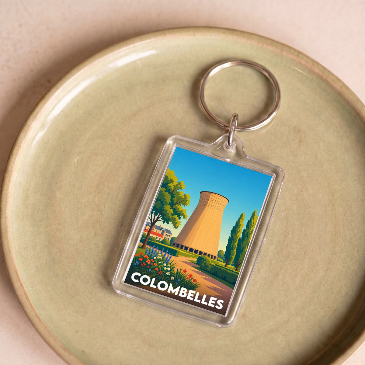 Porte-clés souvenir de la ville de Colombelles avec une illustration stylisée d'une tour de refroidissement.