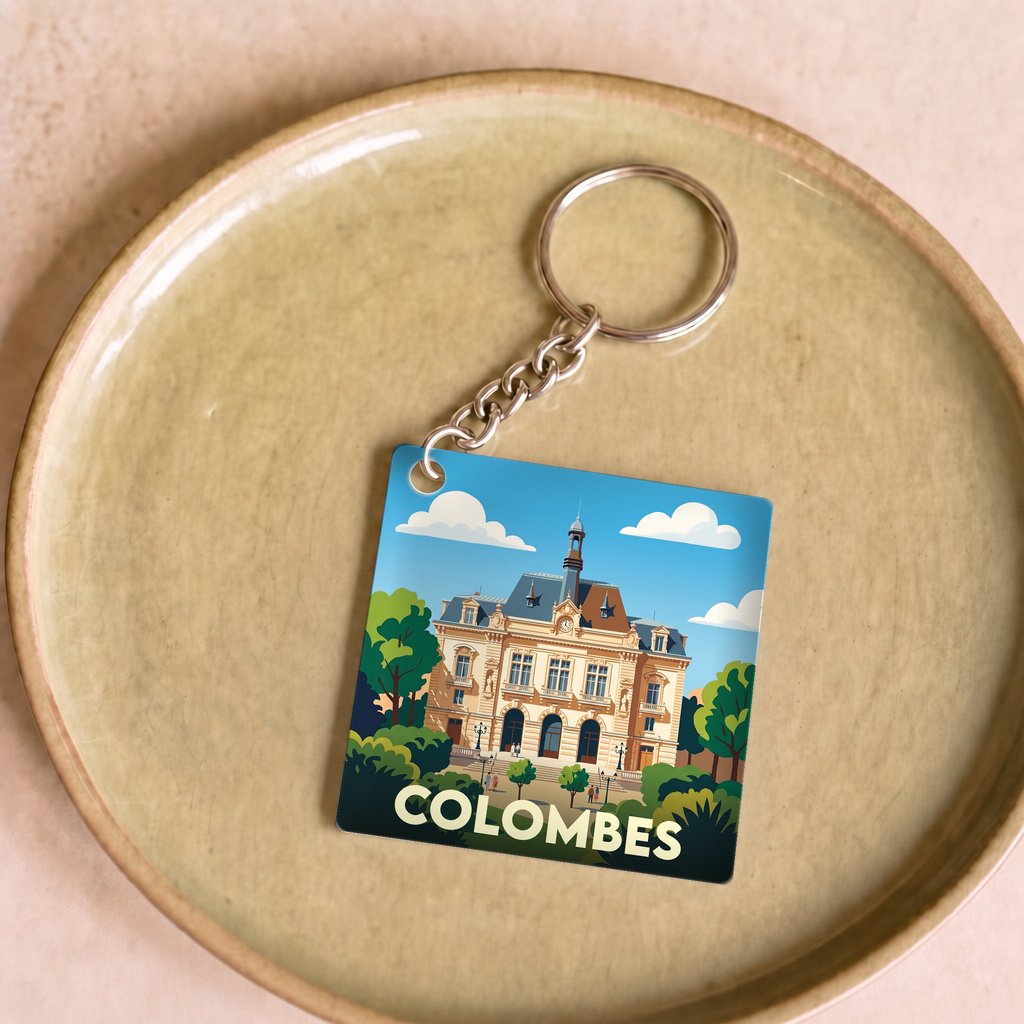 Porte-clés souvenir de la ville de Colombes avec une illustration stylisée.