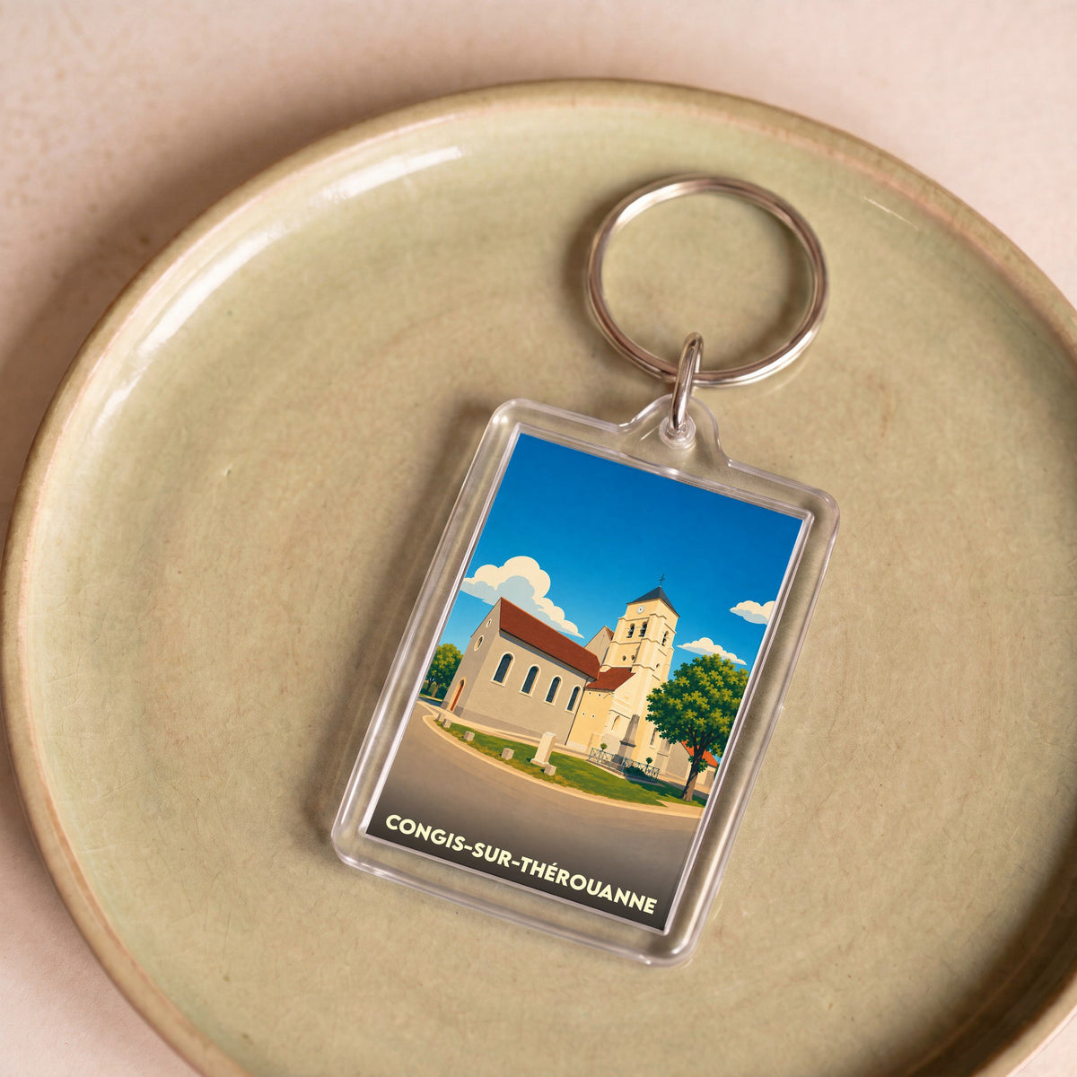 Porte-clés souvenir de la ville de Congis-sur-Thérouanne avec une illustration stylisée de son église.