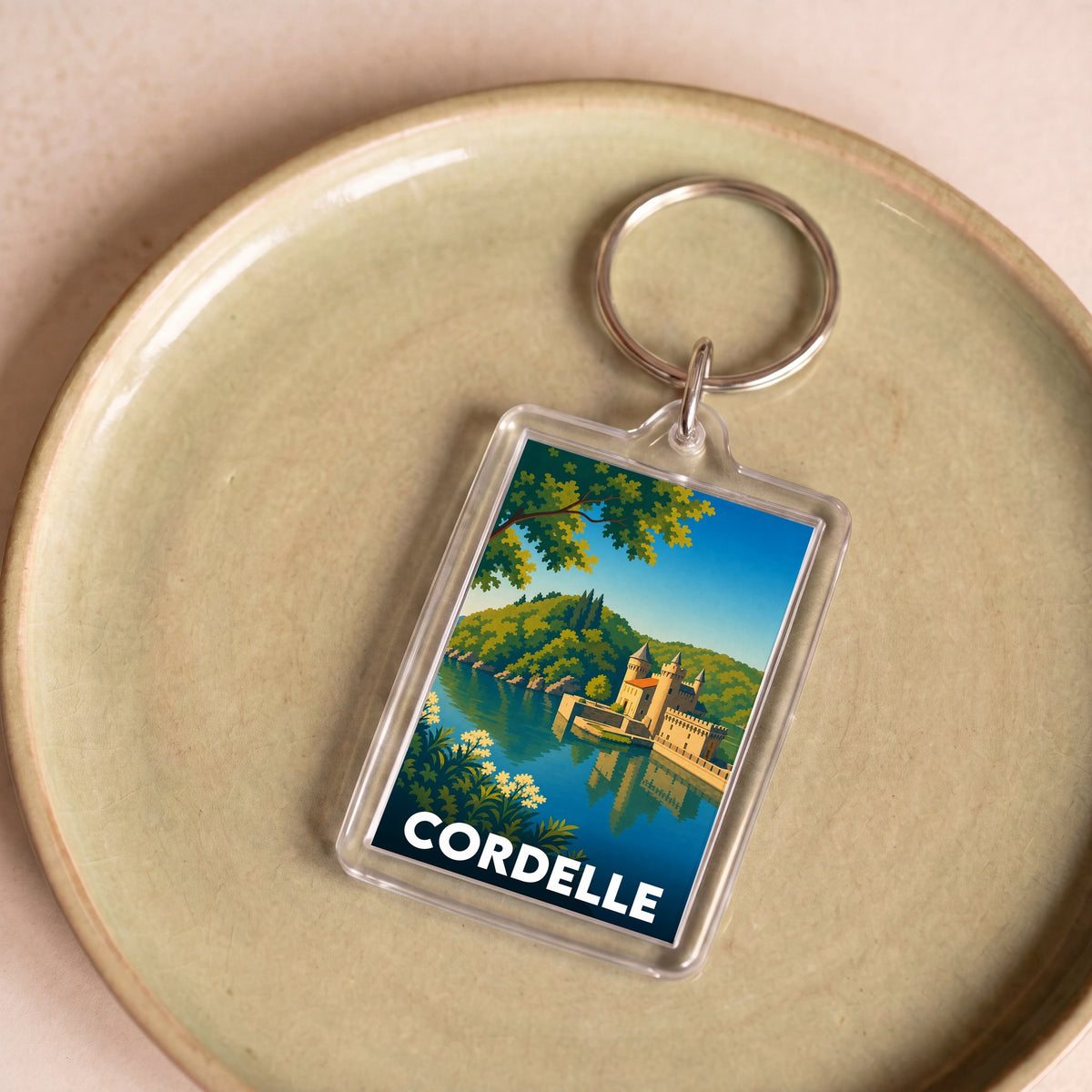 Porte-clés souvenir de la ville de Cordelle avec une illustration stylisée.