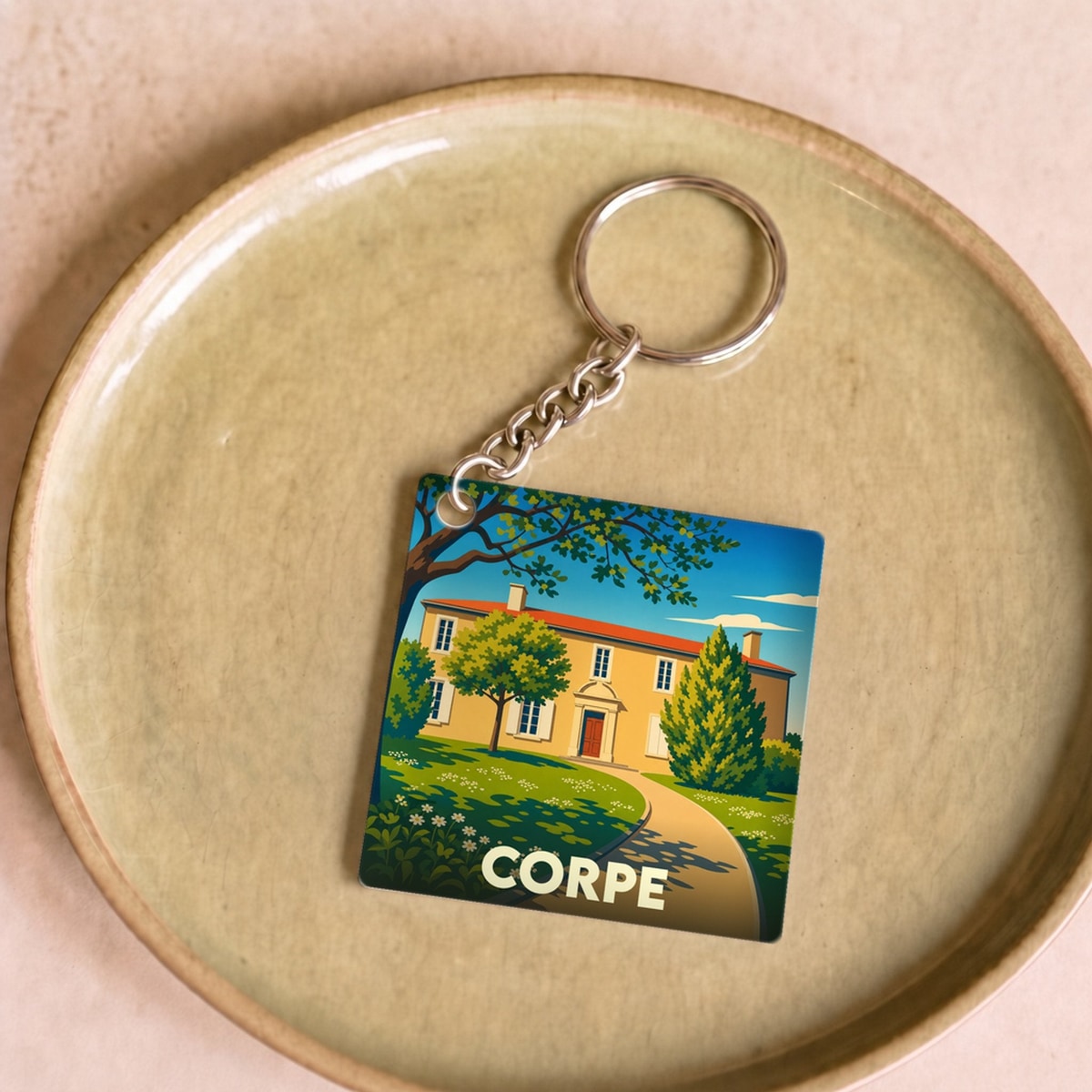 Porte-clés souvenir de la ville de Corpe avec une illustration stylisée.
