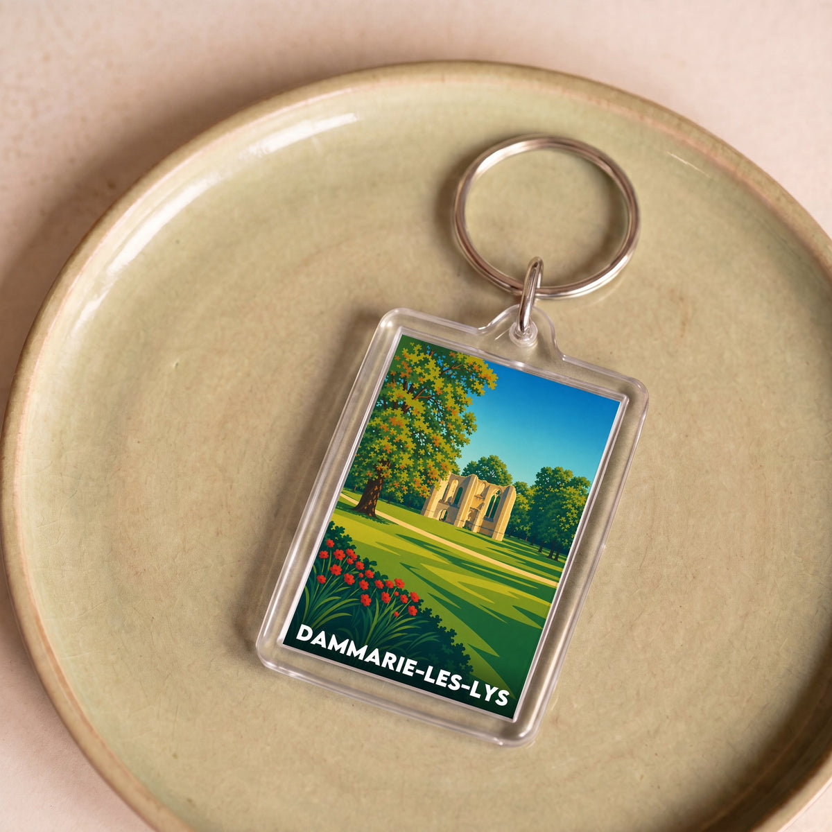 Porte-clés souvenir de la ville de Dammarie-les-Lys avec une illustration stylisée.