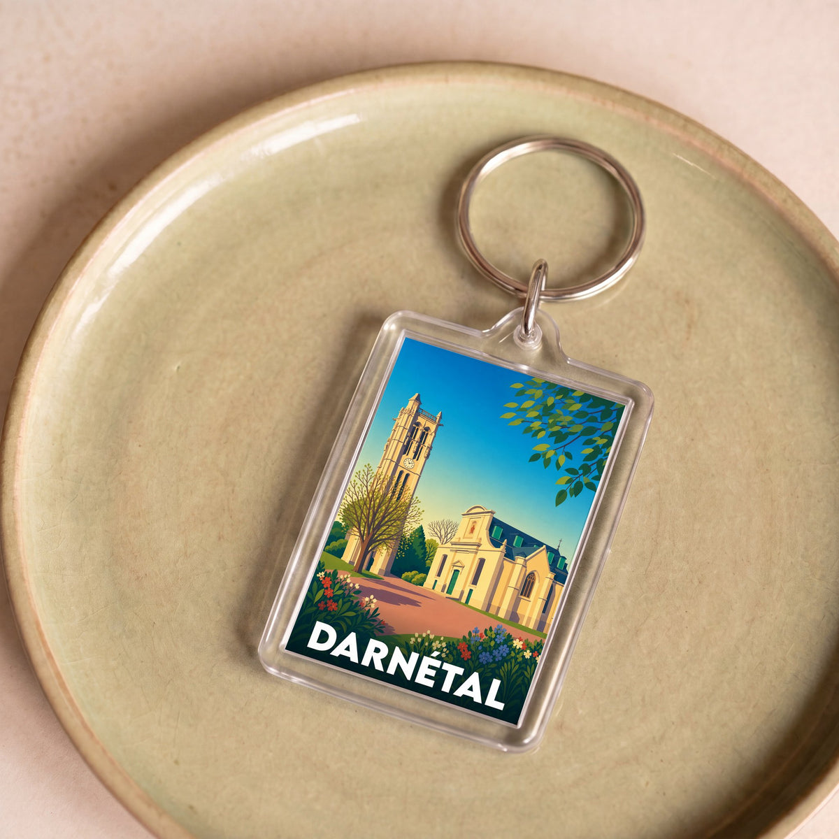 Porte-clés souvenir de la ville de Darnétal avec une illustration stylisée de son patrimoine.