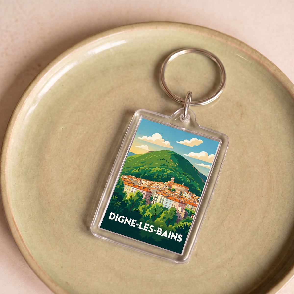 Porte-clés souvenir de la ville de Digne-les-Bains avec une illustration stylisée.