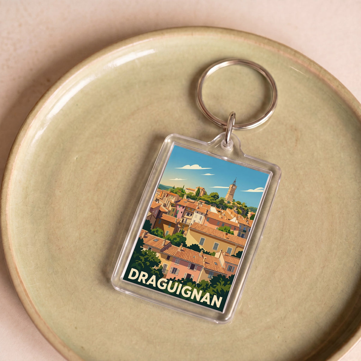 Porte-clés souvenir de la ville de Draguignan avec une illustration stylisée.