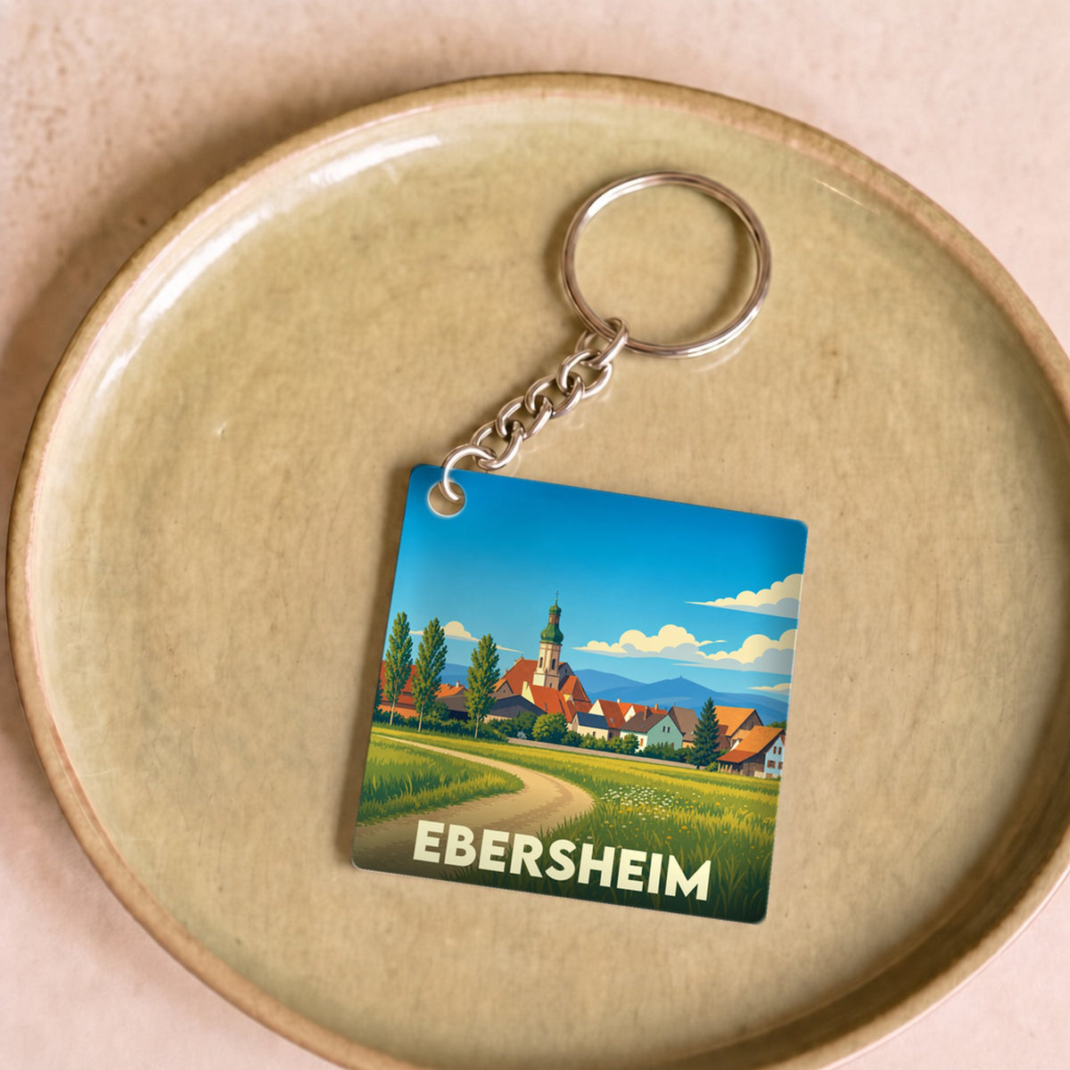 Porte-clés souvenir de la ville d'Ebersheim avec une illustration stylisée.