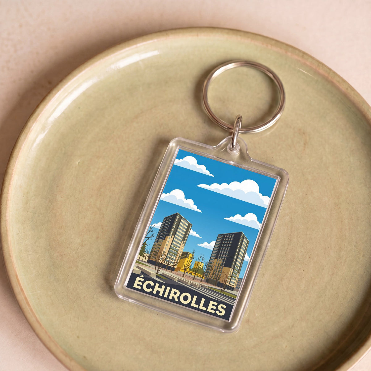 Porte-clés souvenir de la ville d'Échirolles avec une illustration stylisée.