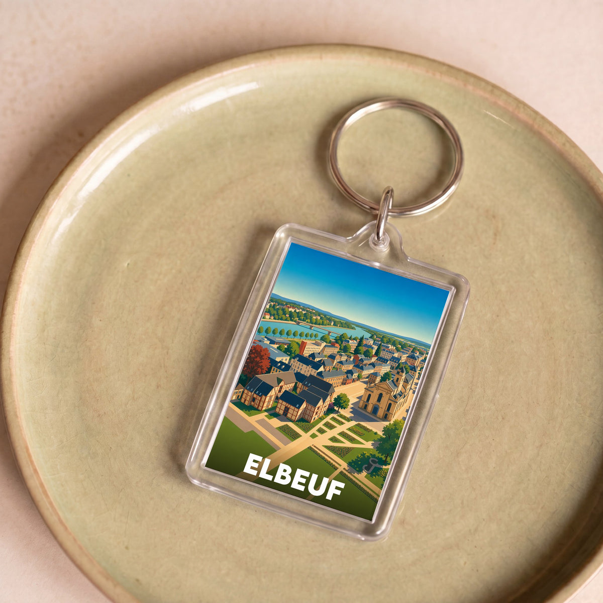 Porte-clés souvenir de la ville d'Elbeuf avec une illustration stylisée.