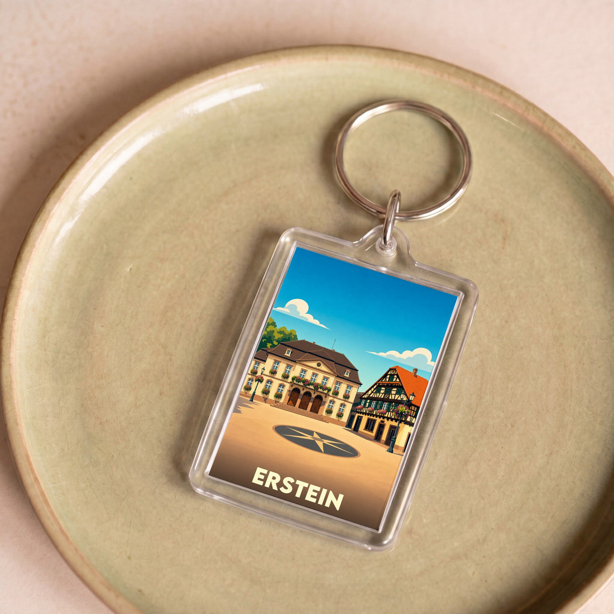 Porte-clés souvenir de la ville d'Erstein avec une illustration stylisée.
