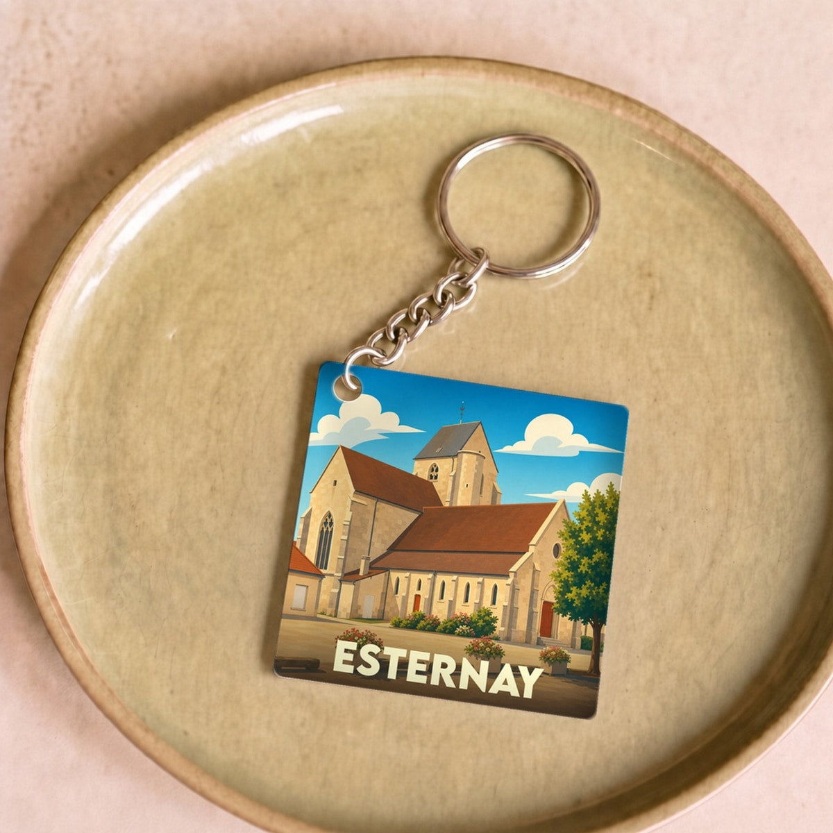 Porte-clés souvenir de la ville de Esternay avec une illustration stylisée.