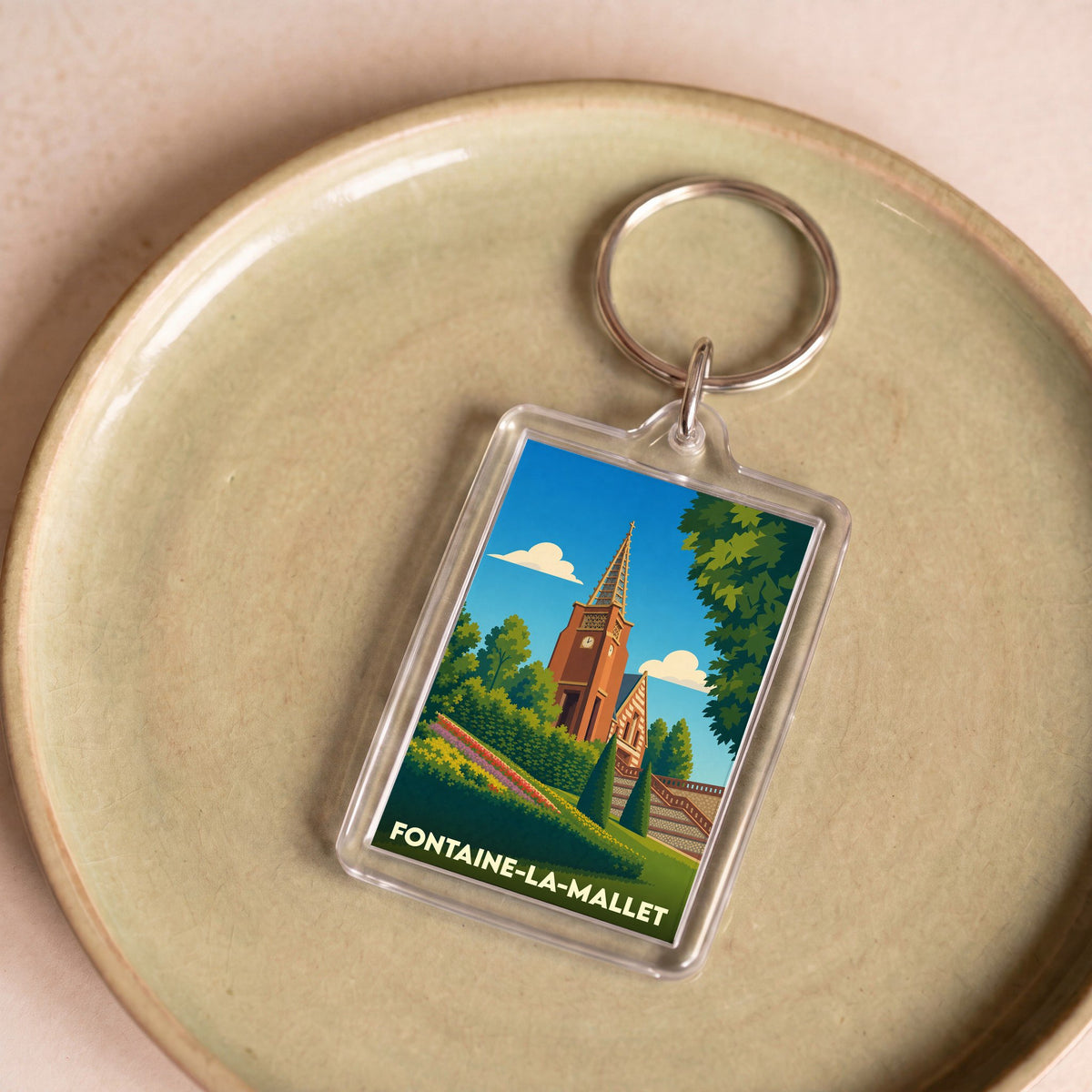 Porte-clés souvenir de la ville de Fontaine-la-Mallet avec une illustration stylisée.
