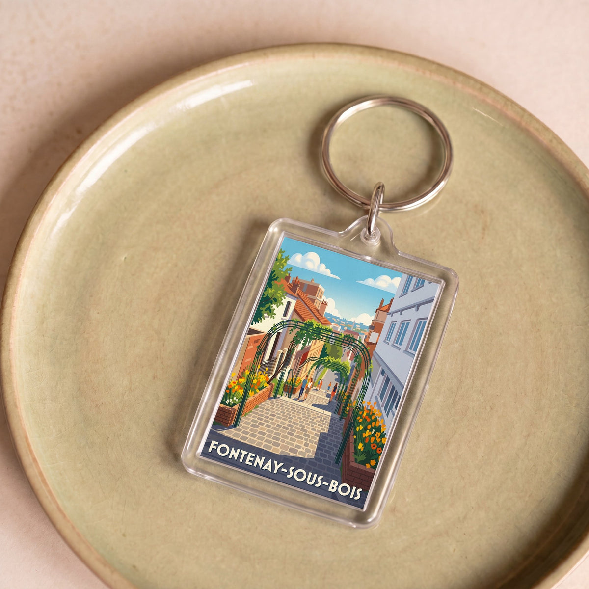 Porte-clés souvenir de la ville de Fontenay-sous-Bois avec une illustration stylisée.