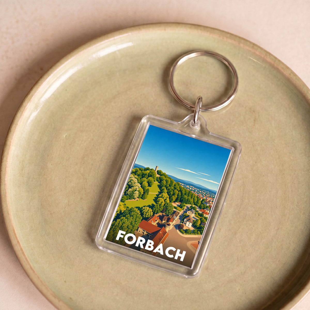 Porte-clés souvenir de la ville de Forbach avec une illustration stylisée.