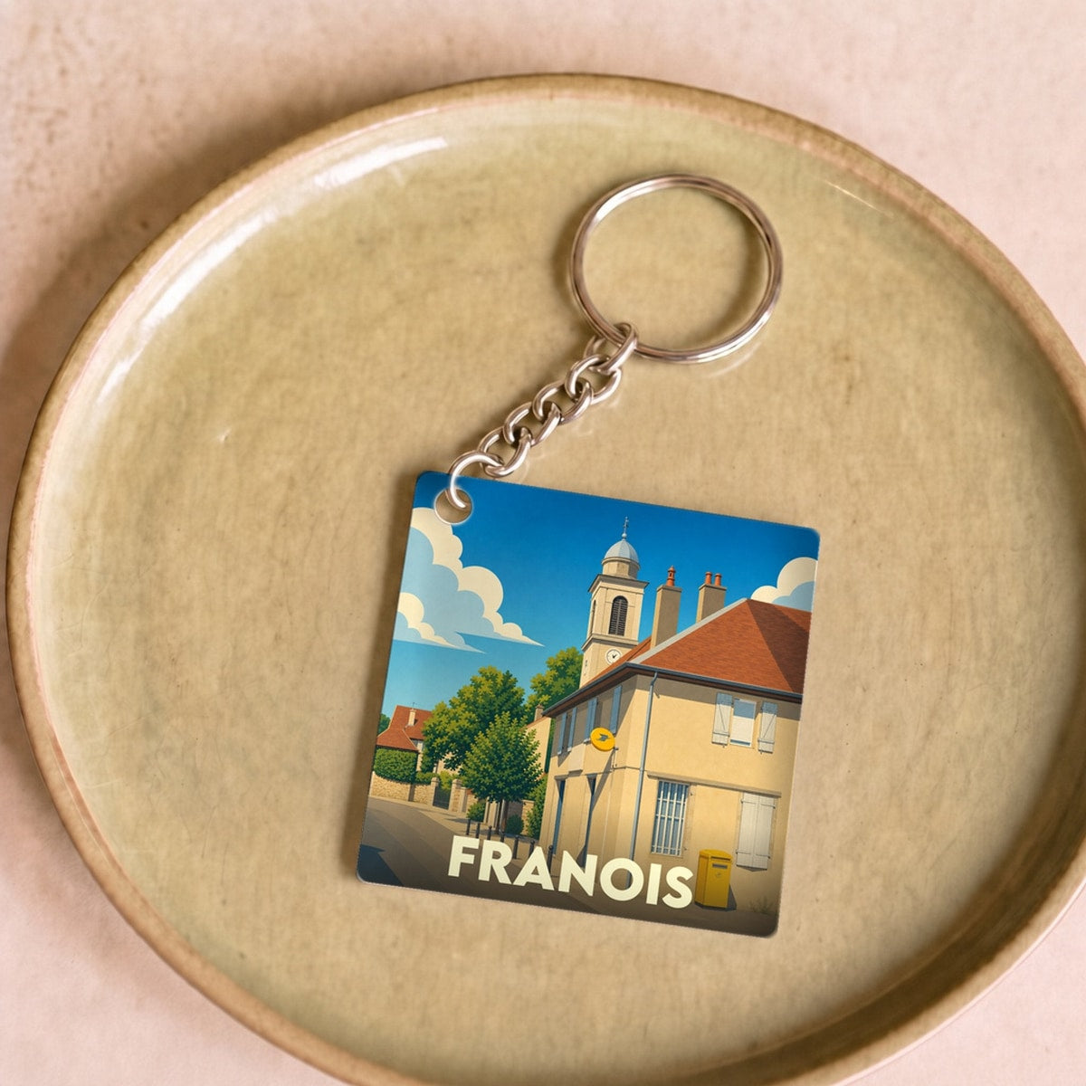 Porte-clés souvenir de la ville de Franois avec une illustration stylisée.