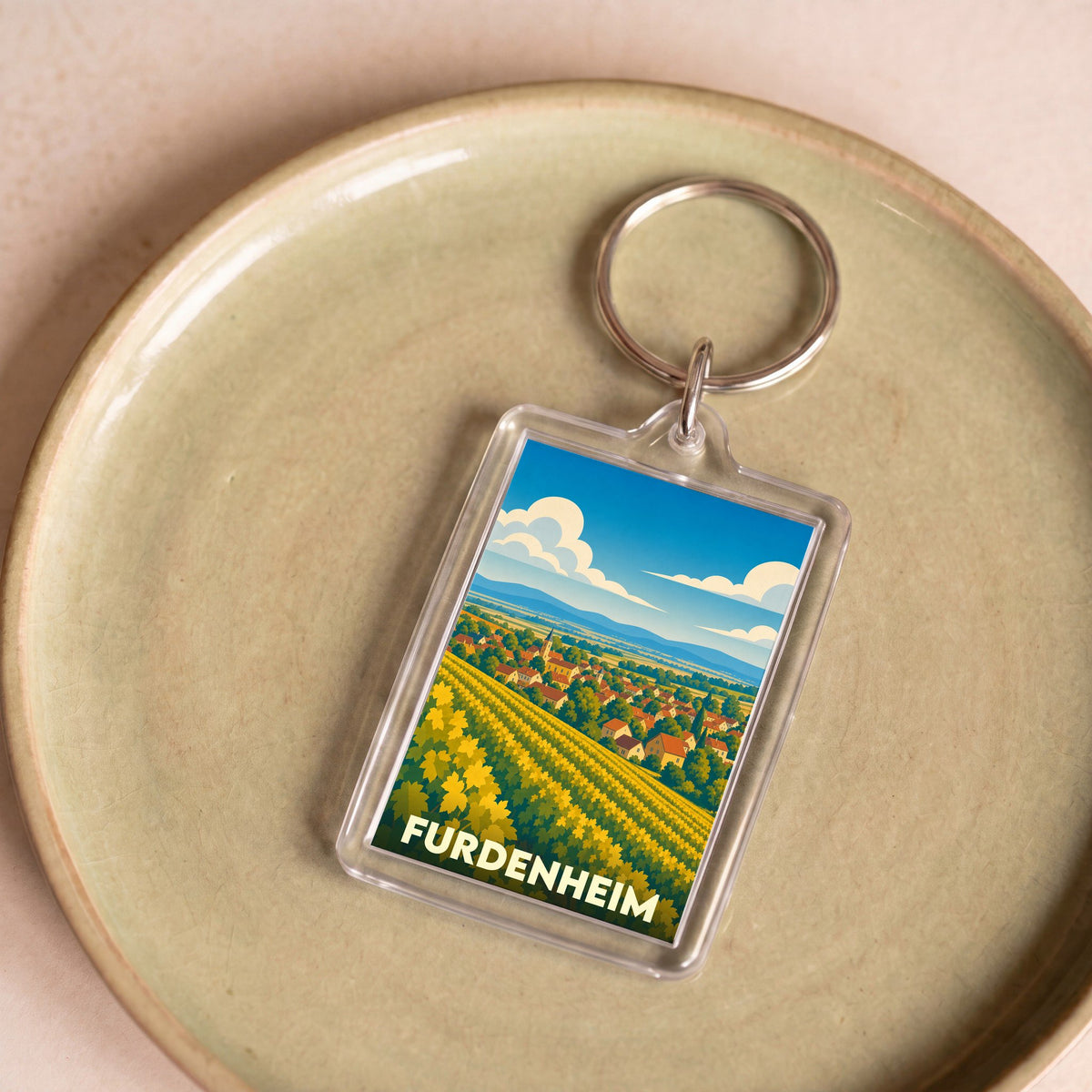 Porte-clés souvenir de la ville de Furdenheim illustré d'un paysage de vignes stylisé.