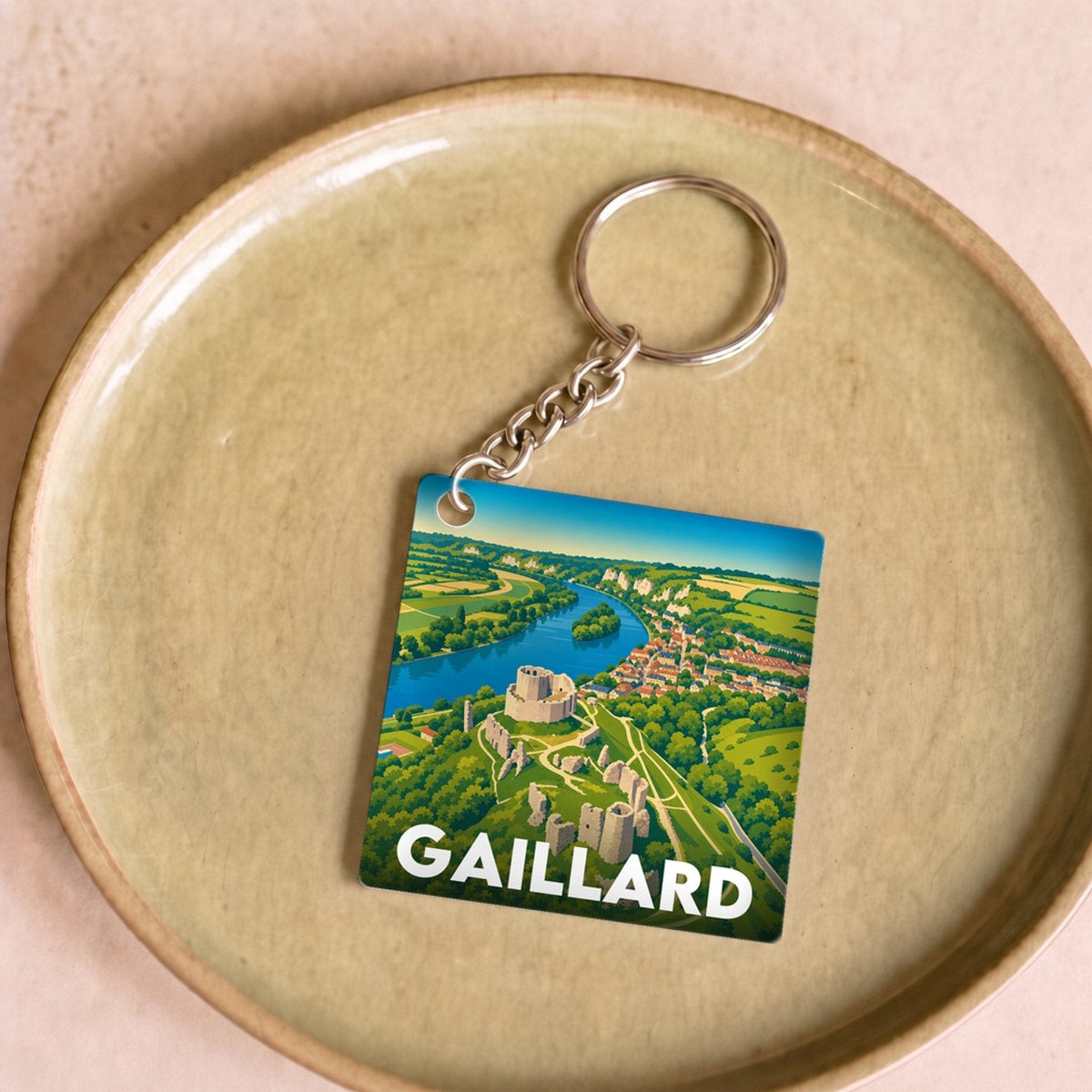 Porte-clés souvenir de la ville de Gaillard avec une illustration paysagère stylisée.