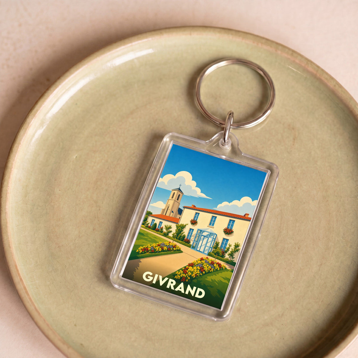 Porte-clés souvenir de la ville de Givrand avec une illustration stylisée.