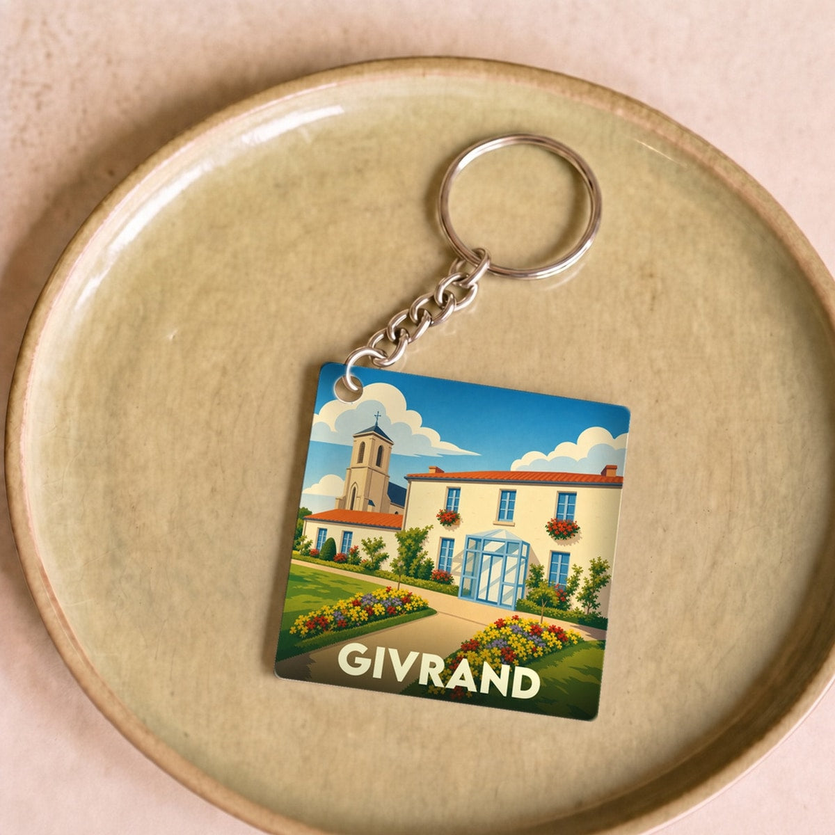 Porte-clés souvenir de la ville de Givrand avec une illustration stylisée.