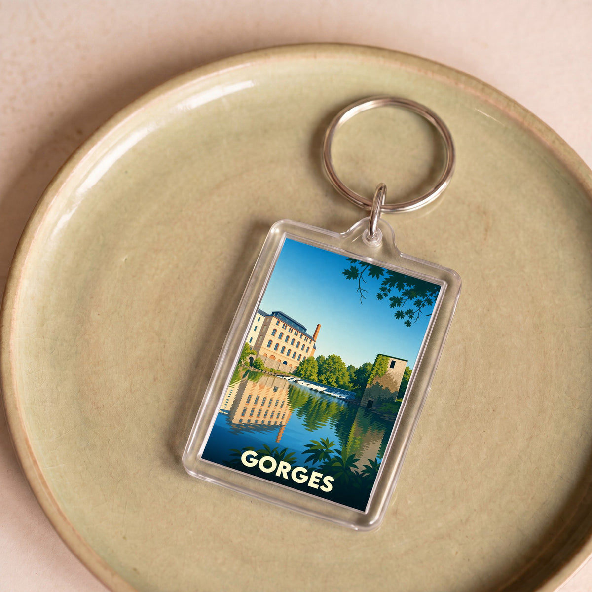 Porte-clés souvenir de la ville de Gorges avec une illustration stylisée.
