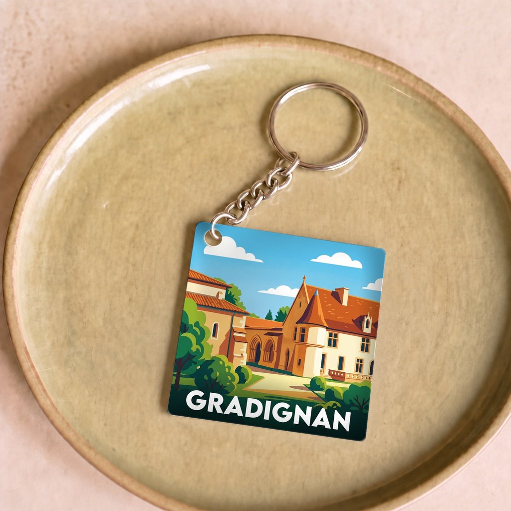 Porte-clés souvenir de la ville de Gradignan avec une illustration stylisée.