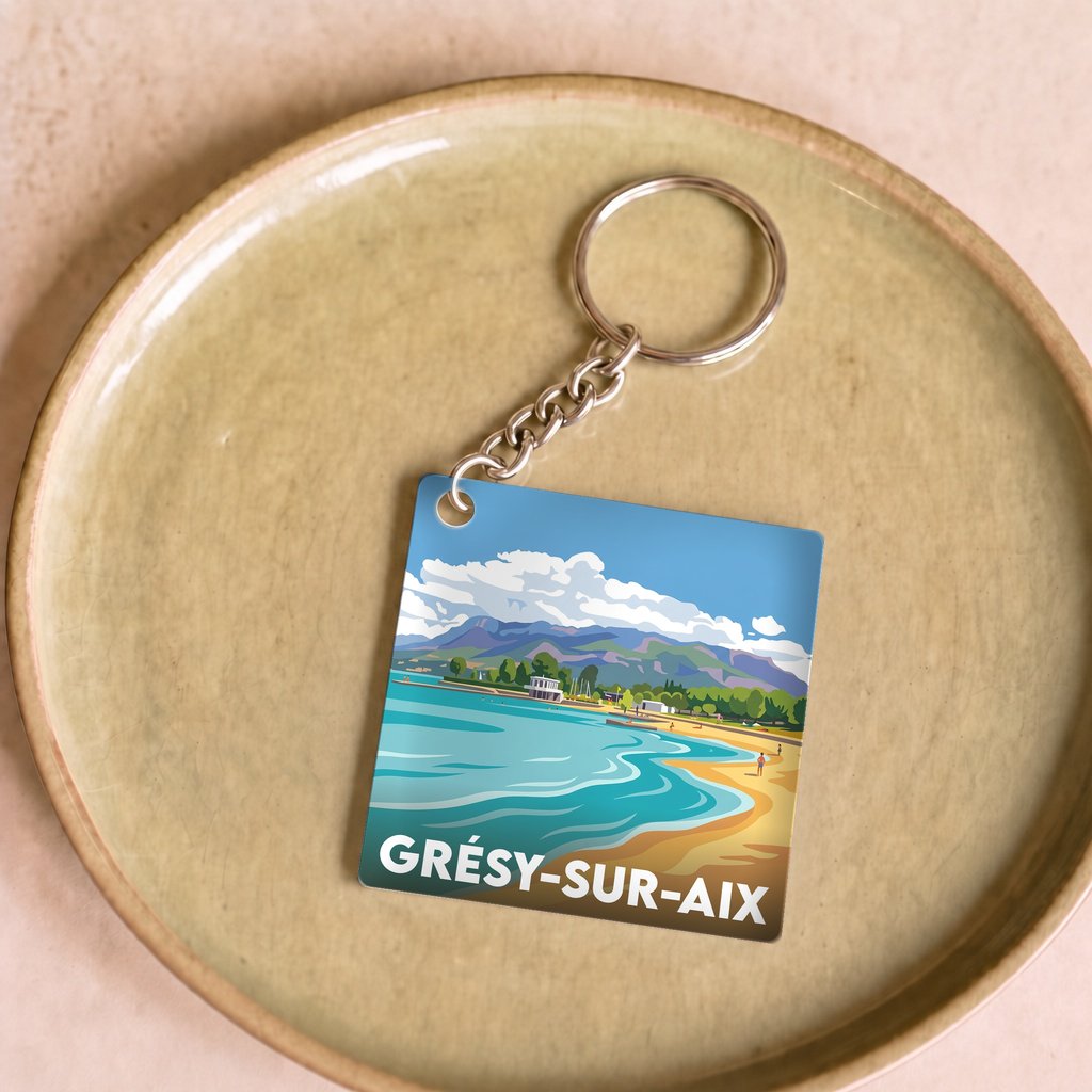 Porte-clés souvenir de la ville de Grésy-sur-Aix avec une illustration stylisée.