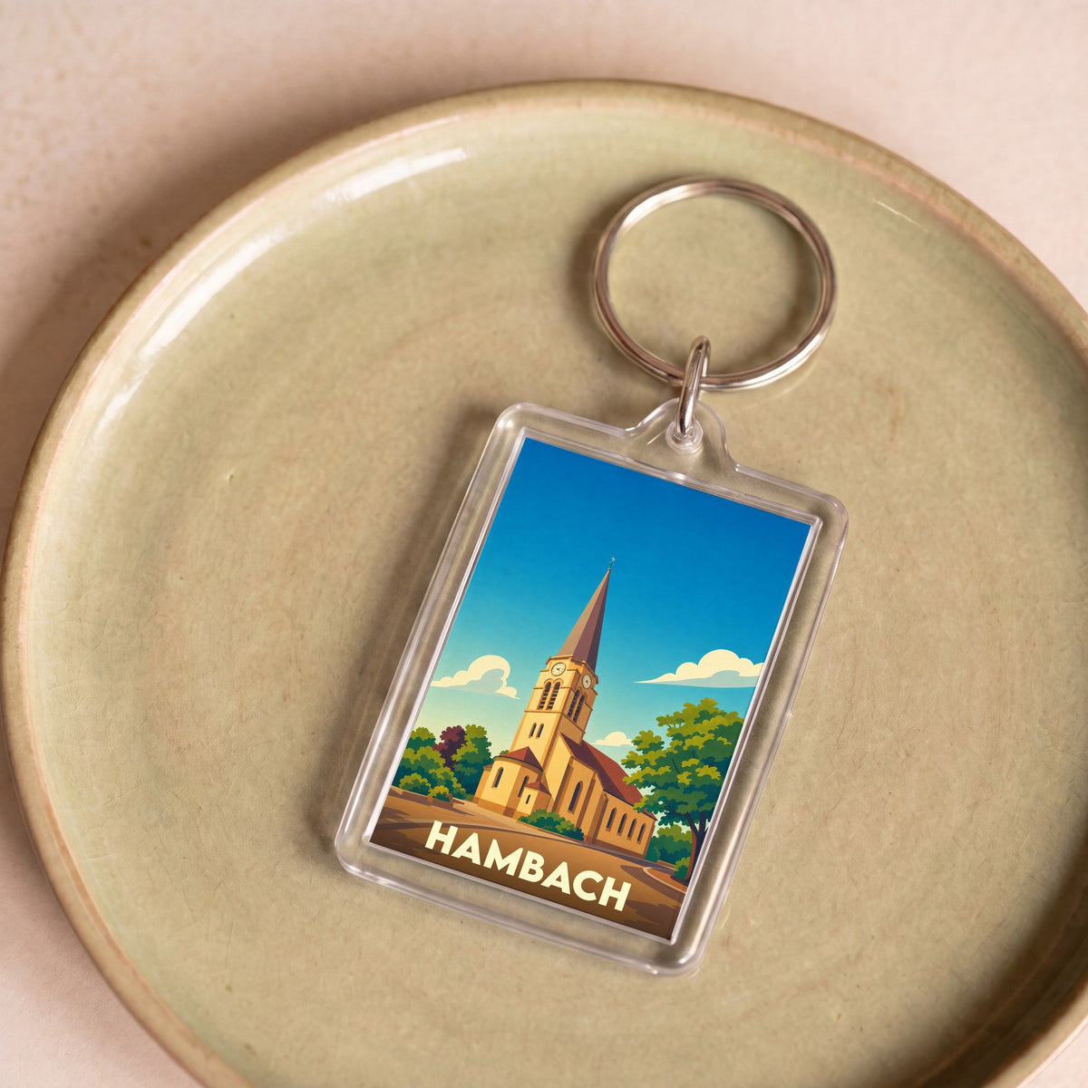 Porte-clés souvenir de la ville de Hambach avec une illustration stylisée de son église.