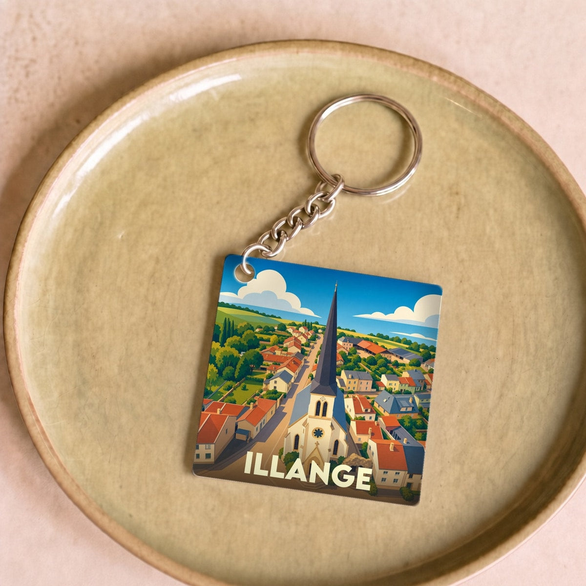 Porte-clés souvenir de la ville de Illange avec une illustration stylisée.