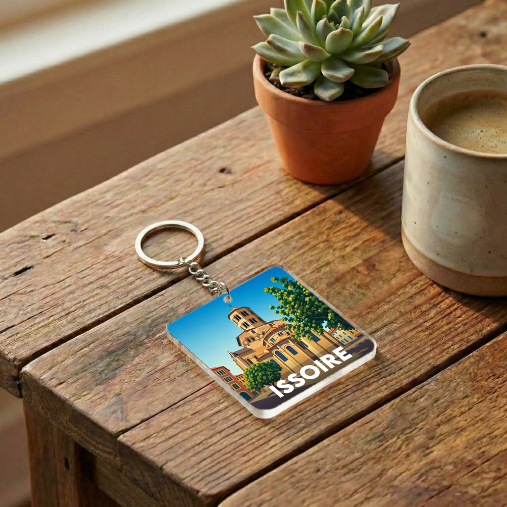 Porte-clés souvenir de la ville d'Issoire avec une illustration graphique stylisée.