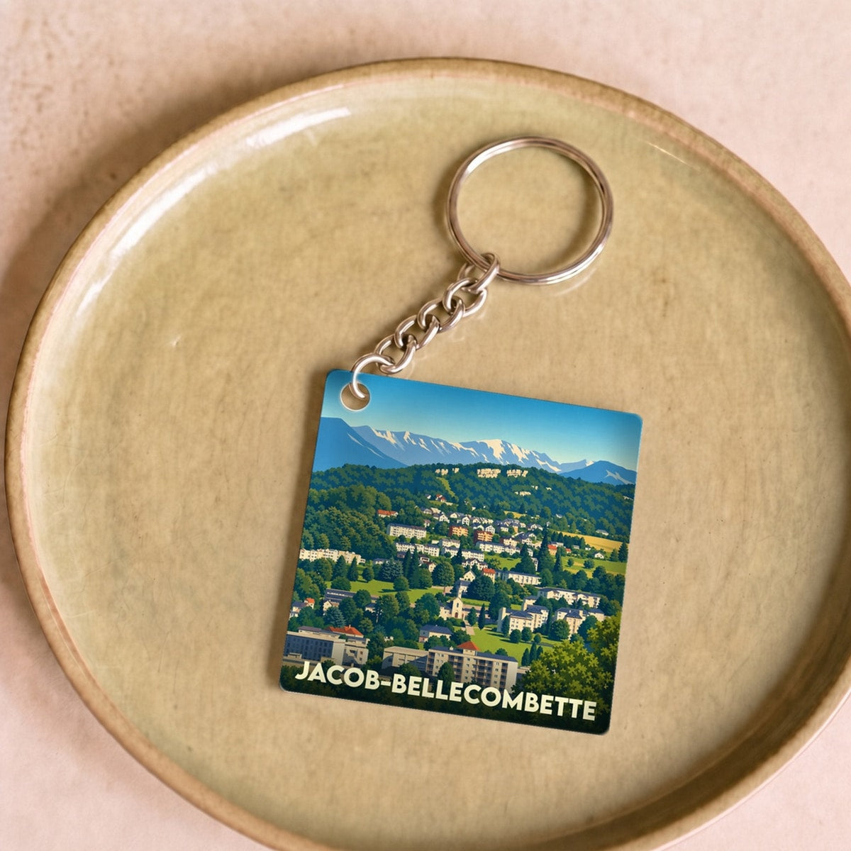 Porte-clés souvenir de la ville de Jacob-Bellecombette avec une illustration stylisée.