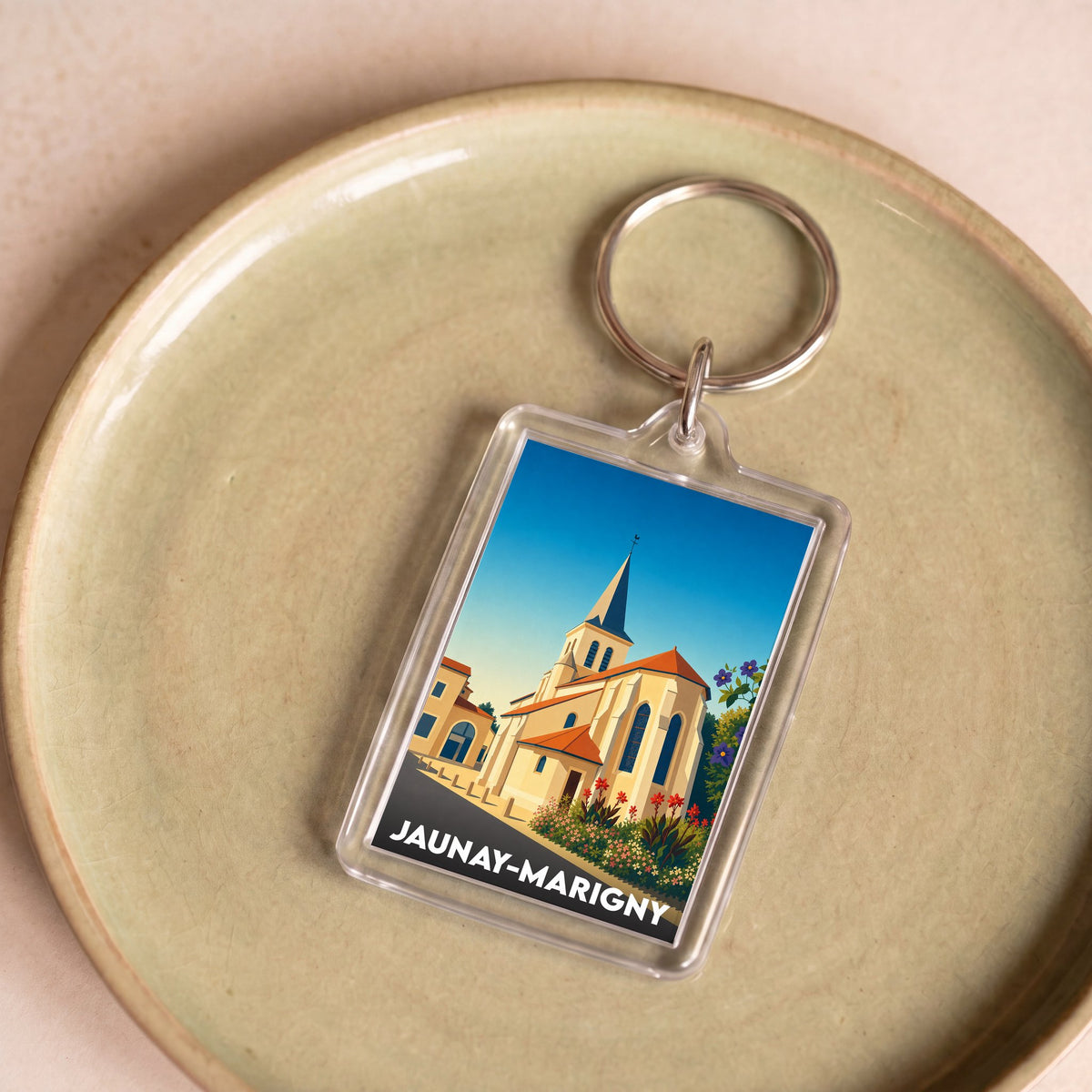 Porte-clés souvenir de la ville de Jaunay-Marigny avec une illustration stylisée d'une église.