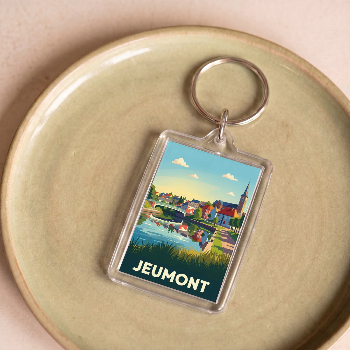 Porte-clés souvenir de la ville de Jeumont avec une illustration colorée et stylisée.