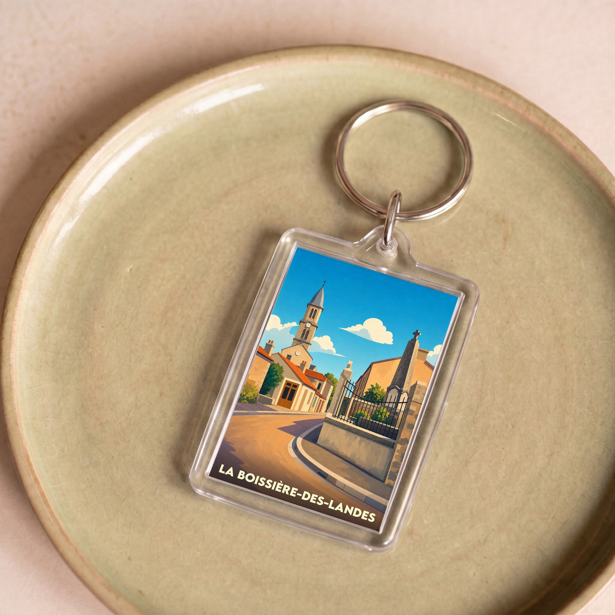 Porte-clés souvenir de la ville de La Boissière-des-Landes avec une illustration stylisée.