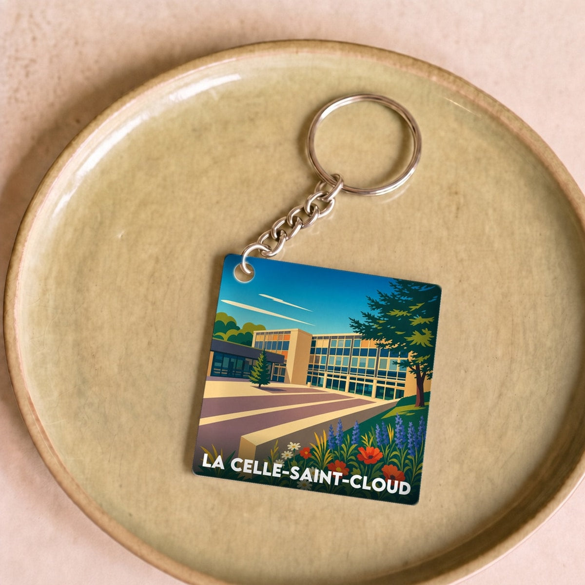 Porte-clés souvenir de la ville de La Celle-Saint-Cloud avec une illustration stylisée.
