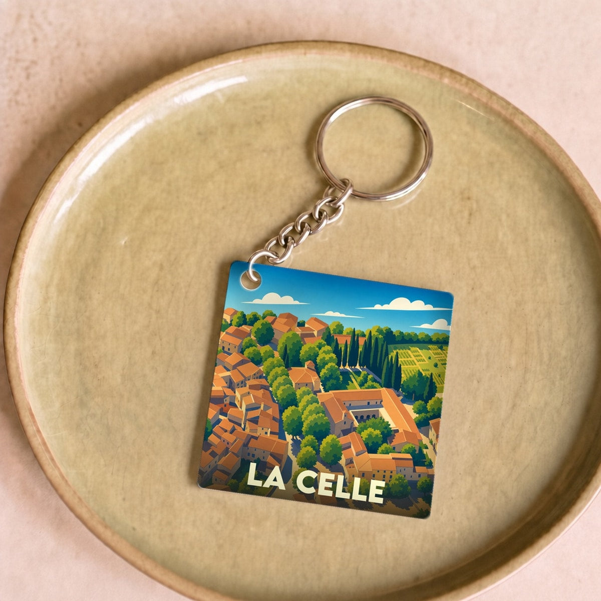 Porte-clés souvenir de la ville de La Celle avec une illustration stylisée.