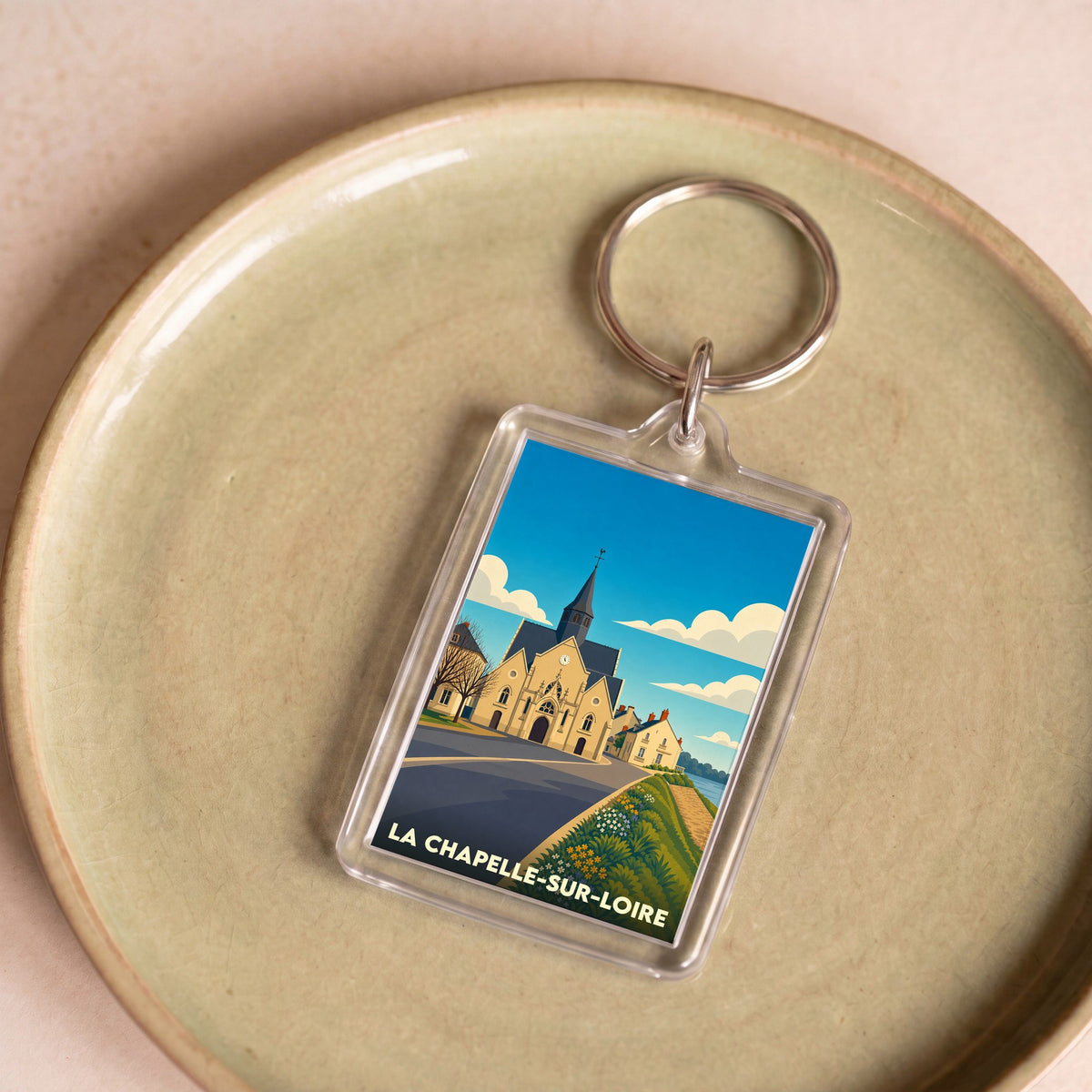 Porte-clés souvenir de la ville de La Chapelle-sur-Loire avec une illustration stylisée.