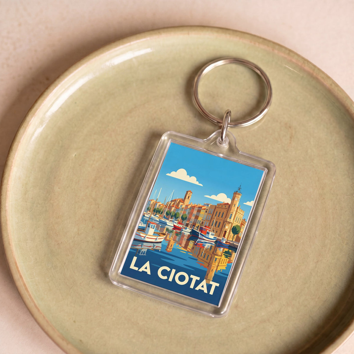 Porte-clés souvenir de la ville de La Ciotat avec une illustration stylisée.