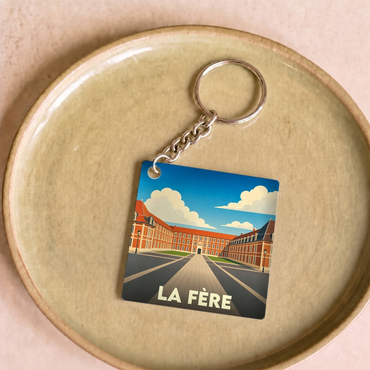 Porte-clés souvenir de la ville de La Fère avec une illustration stylisée.