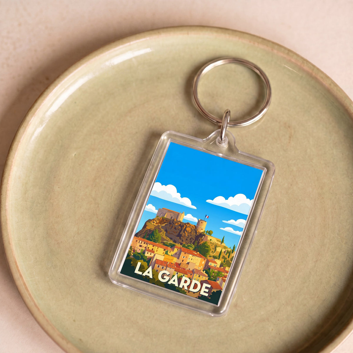 Porte-clés souvenir de la ville de La Garde avec une illustration stylisée.