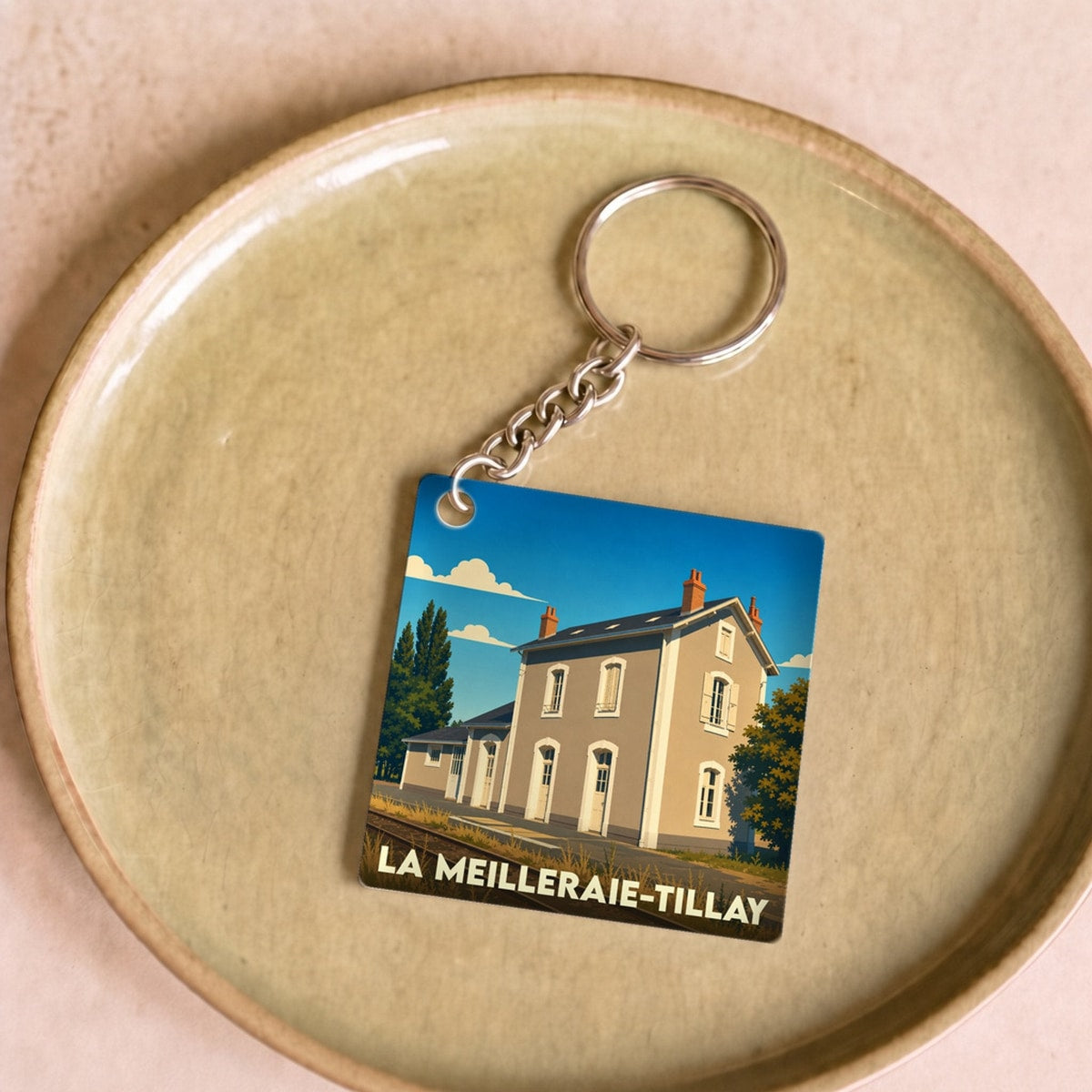 Porte-clés souvenir de la ville de La Meilleraie-Tillay avec une illustration stylisée.