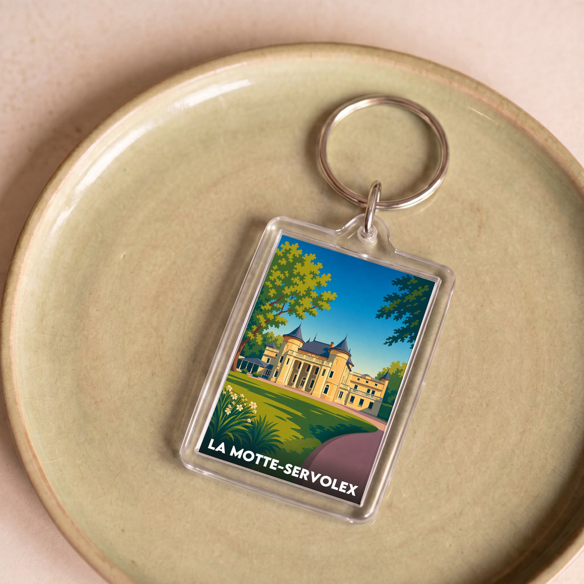 Porte-clés souvenir de la ville de La Motte-Servolex avec une illustration stylisée.