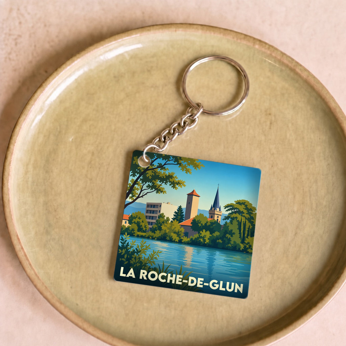 Porte-clés souvenir de la ville de La Roche-de-Glun avec une illustration stylisée.