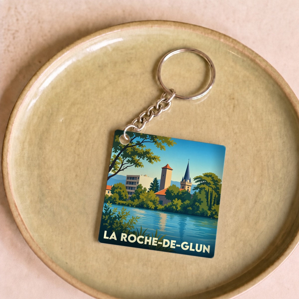 Porte-clés souvenir de la ville de La Roche-de-Glun avec une illustration stylisée.