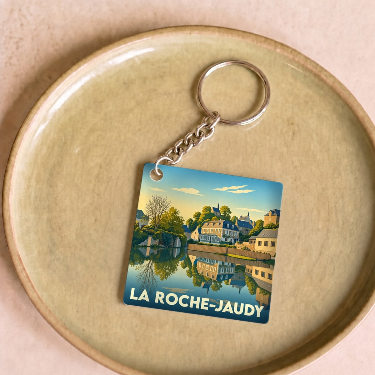 Porte-clés souvenir de la ville de La Roche-Jaudy avec une illustration stylisée.