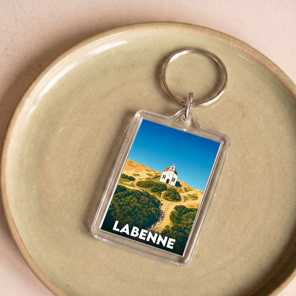 Porte-clés souvenir de la ville de Labenne avec une illustration stylisée.