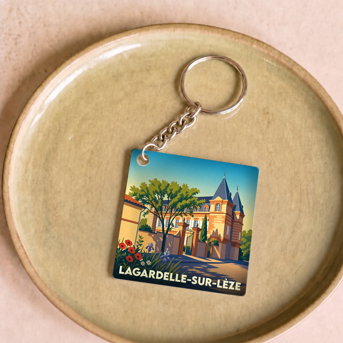 Porte-clés souvenir de la ville de Lagardelle-sur-Lèze avec une illustration stylisée.