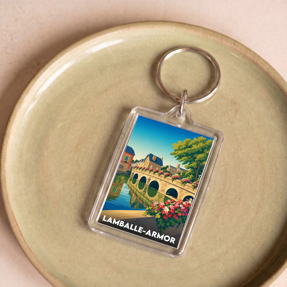 Porte-clés souvenir de la ville de Lamballe-Armor avec une illustration stylisée.