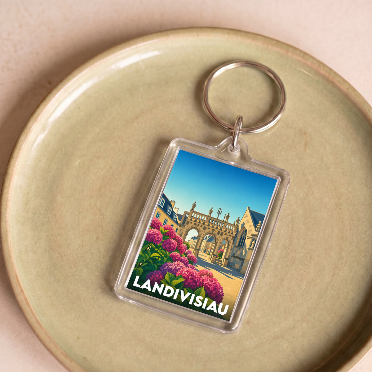 Porte-clés souvenir de la ville de Landivisiau avec une illustration stylisée.