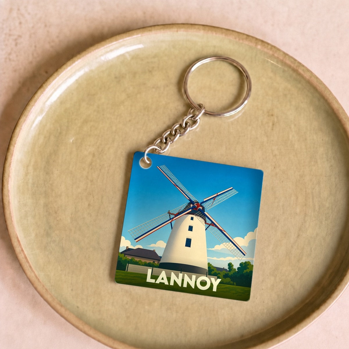 Porte-clés souvenir de la ville de Lannoy avec une illustration stylisée d'un moulin.