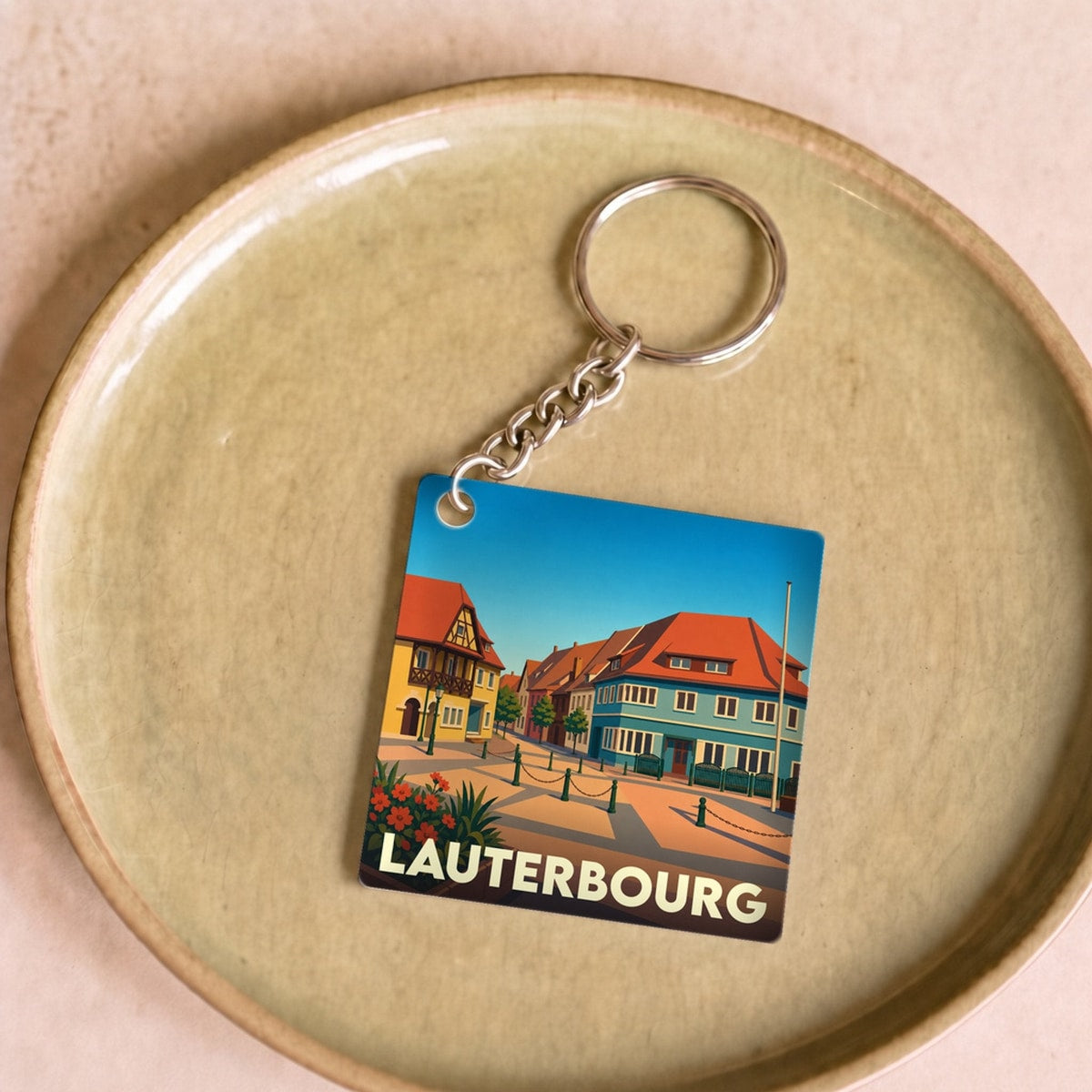 Porte-clés souvenir de la ville de Lauterbourg avec une illustration stylisée.